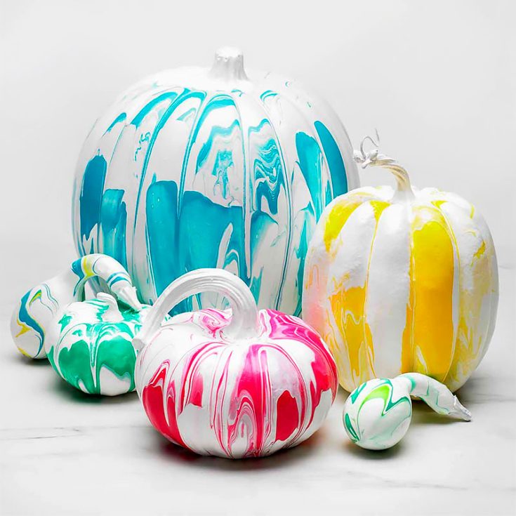 This is one of those easy painting pumpkin ideas. Use a white-covered pumpkin, big or small as a base. It uses a painting technique called "pouring paint" or fluid painting. With this technique, the colored paint creates pumpkins uniquely covered with swirls and whirls that will not look the same!