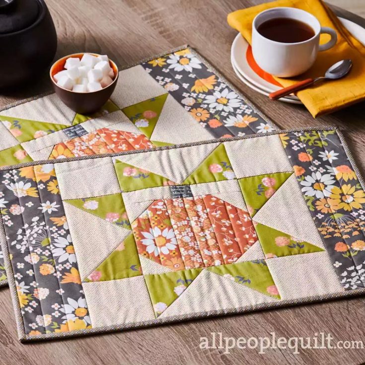 Here&rsquo;s another quilted placemat you can try making during the holiday season! Filled with fall colors, a floral star design, and a cute pumpkin motif in the center, this design creates a cozy and subtle festive atmosphere for your table. If you want to make this star quilt block into a blanket, feel free to do so! Just make sure to measure the appropriate blocks for your preferred size. The finished size is 12 &frac12;&rdquo; x 18 &frac12;&rdquo;.