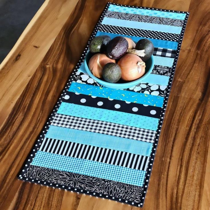 Check out this fantastic table runner pattern that is scrap-friendly! This stash-buster project is an easy and quick design because it's a quilt-as-you-go project &mdash; trim and bind. It's a lovely design that brightens up your space, and the tutorial is also easy to follow.&nbsp; Table runner size: 14" x 36".