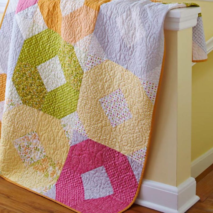 In the mood for a pastel-looking quilt? Say less and try quilting this gorgeous quilt with calming hues called the Ring Toss Quilt! This pastel-colored quilt uses vibrant yet soft tones that result in a generous lap-sized quilt that measures 48 &frac12;" x 64 &frac12;". Not only is it soothing to the eyes, but it's so squishy to cuddle in!&nbsp;