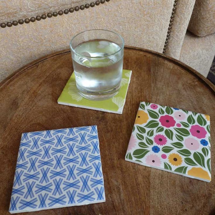Wondering what to do with extra scrap paper? Try crafting these custom coasters by covering plain tiles with scrapbook paper that reflects your style. It's fun to add a personal touch to your space with your favorite patterns and colors.