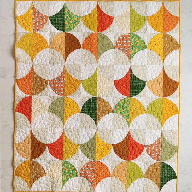Say hello to this darling of scrappy quilt! Though this isn't a tutorial, feel free to take inspiration from this warm and calming pattern to make a scrap quilt with the same layout! It comes in four sizes, from baby to queen.&nbsp;