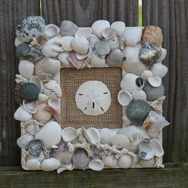 Wondering what to do with all those seashells instead of tossing them in a box? How about learning how to make this keepsake memory frame? With just a chunky wood frame from the dollar store, some shells, and hot glue, this quick and easy project turns your beach treasures into a lovely display!