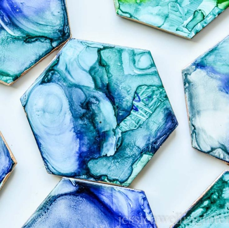 These stunning tile coasters can be easily crafted by scribbling with Sharpies on a plain tile and adding a splash of isopropyl alcohol for mesmerizing patterns.