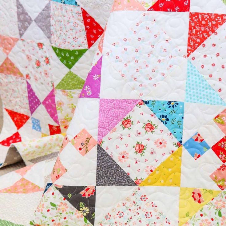 Now, this pattern is the epitome of a scrap quilt! It combines many print collections from scraps with various floral and geometric prints on light for the alternate squares to add visual interest. Add a light-colored base for the background to make it stand out even more. The finished size is approximately 66.5" x 78.5".