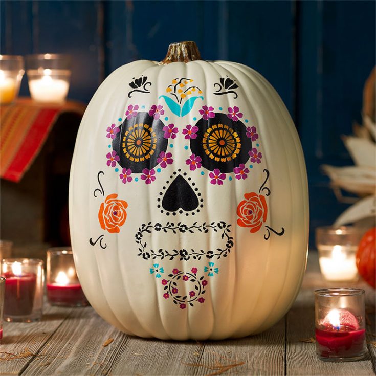 I love painting face ideas on pumpkins. This Dia de Los Muertos pumpkin features exactly that! You'll have to use stencils before you paint in this design.