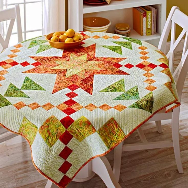 Besides your regular star quilt patterns, you can use this design to make a lovely table topper, wall hanging, or a throw quilt! This piece features a radiant star design in fiery reds, yellows, and orange batiks, set against a soothing pale green background. The final size measures up to 48 &frac12;&rdquo; x 48 &frac12;&rdquo;.