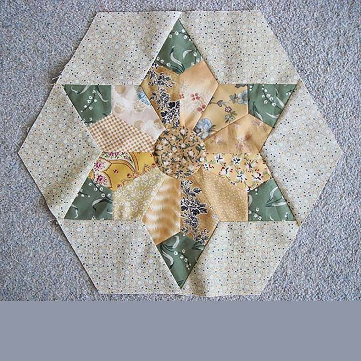 This is a wonderful quilt consisting of a Dresden-style sunflower, some leaves, and a backdrop made of diamond-shaped pieces! This tutorial calls for freezer paper to make the center circle applique.