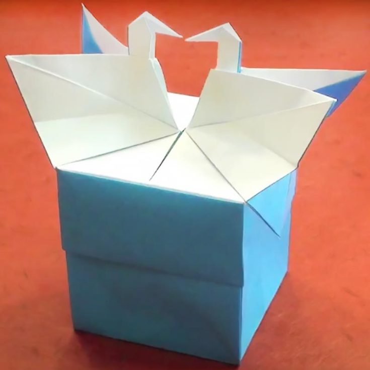 Learn how to make a box with a beautiful double swan lid. This sophisticated design can be a great addition to your origami crafts. It's also an excellent option for storing items from previous crafting projects, like buttons, yarn, and bobby pins.
