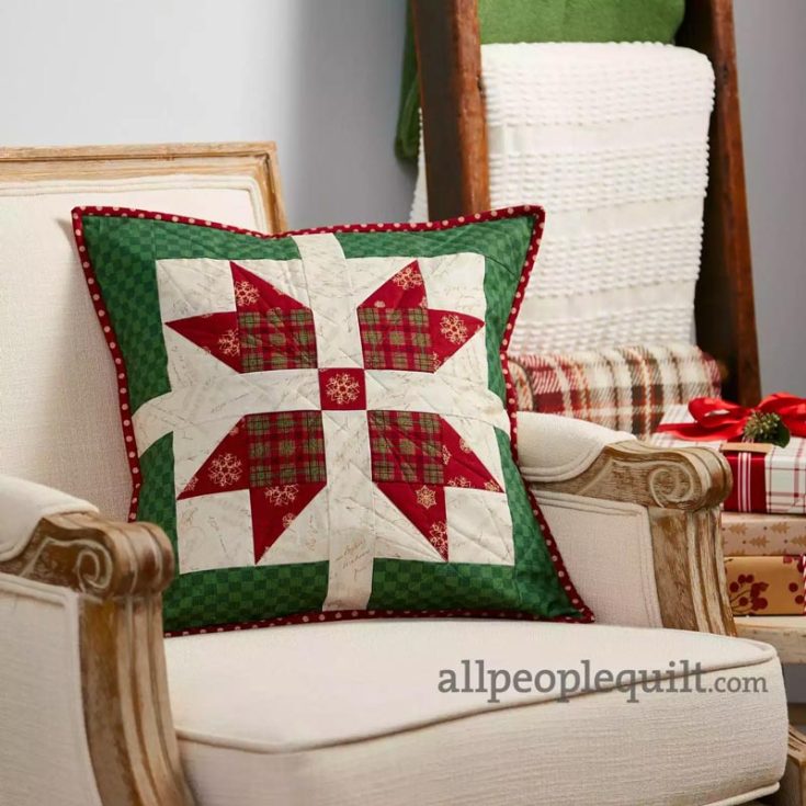 Did you know that you can make adorable pillows from star quilt patterns? Using fabrics from the Postcard Holiday collection, you, too, can make this lovely Christmas-themed 17&rdquo; x 17&rdquo; pillow to add a cozy ambiance to your living space. This pattern is ideal for beginners, and the best part of this star motif is that it appears to be divided into quarters by a ribbon and center bow, which is like a present!