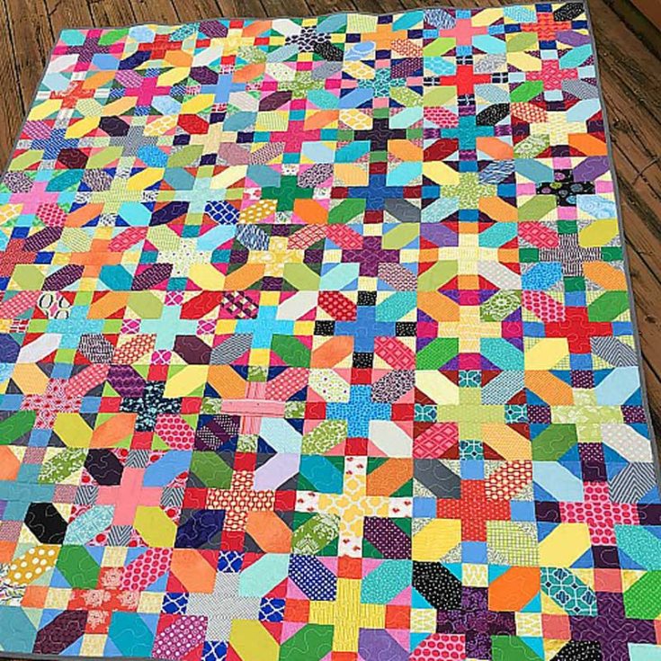 This is one of our personal favorites because of how simple yet intricate this design is! It's a twin-sized quilt that measures approximately 70" x 90" and looks oh-so-stunning. It's the perfect go-to scrappy quilt design incorporating your entire stash, and it's an ideal upcycling project.